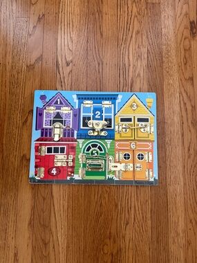 Melissa & Doug Latches Learning Board - Purple Blue Yellow Red Green Orange